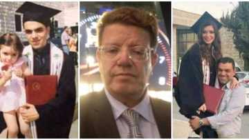 Dad celebrates daughter's graduation, carries her to recreate his own grad photo