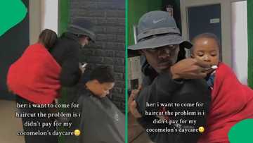 "This is ubuntu": Barber holds child, helps mom who can't afford daycare