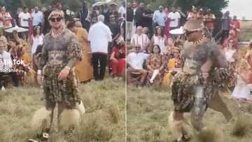 White man in Zulu attire doing intense traditional routine, fully tattoed guy's indlamu attempt on TikTok has Mzansi entertained