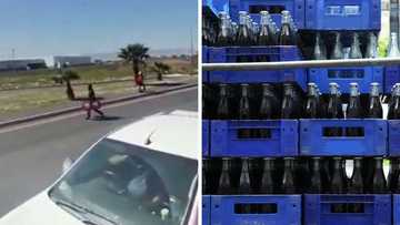 Opportunistic criminal steal crates of cooldrink from stationary truck, South Africa in disbelief