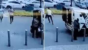 Video of armed man grabbing money box from cash in transit van and running away on foot leaves SA suspicious