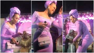 Come and see someone's mother o: Reactions as lady steals wedding show with palliative dance moves in video