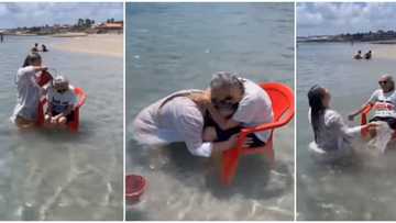 Lady spotted in video bathing her 94 year old grandma with a chair in the ocean to make her dream come true