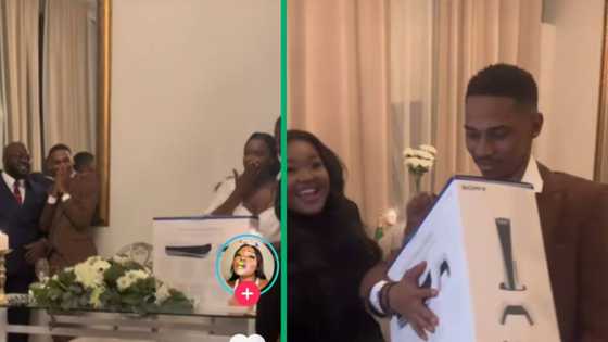 Bride's reaction priceless as groom dances with PS5 wedding gift