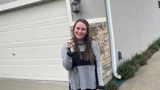 Lady who lived in trailer buys own house, celebrates win with adorable photo