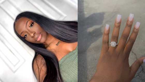 Young lady heads online to swoon over her flashy new engagement ring