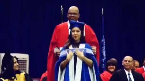 Couple shares sweet moment as doctor husband bestows wife her PhD sash