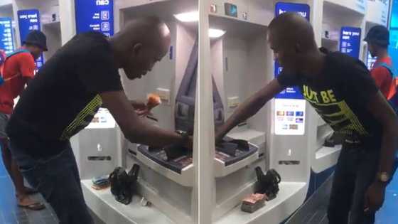 Man with large amounts of cash at ATM has SA scratching heads as man organises stacks of money, "Lobola or deposit"