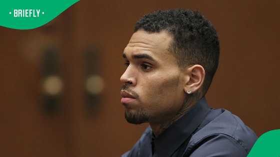 CCTV shows Chris Brown striking man with a tequila bottle in London nightclub brawl