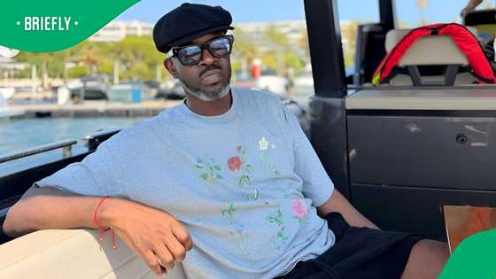 Black Coffee rubs shoulders with Kanye West alongside girlfriend Victoria and son Esona