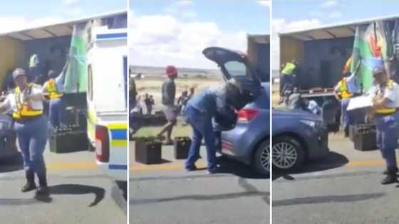 Angry man films people looting a broken-down truck filled with booze while police watch, SA shares feelings