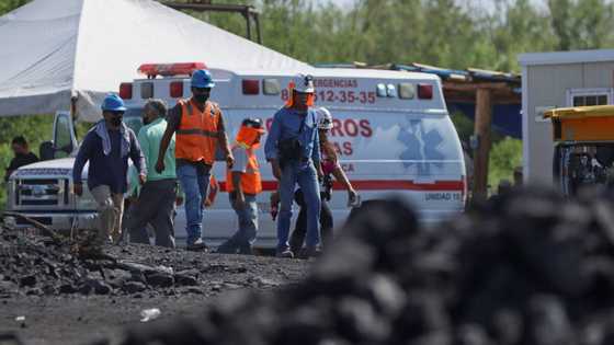 Families of trapped Mexican miners pray for miracle