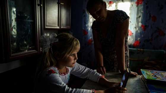 Ukraine schools return to sound of war