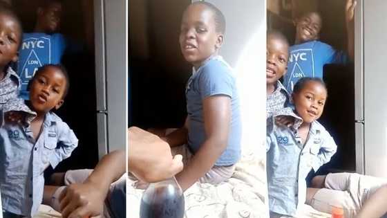 Playful man makes little kids sing about how much of an amazing uncle he is for cooldrink in funny video