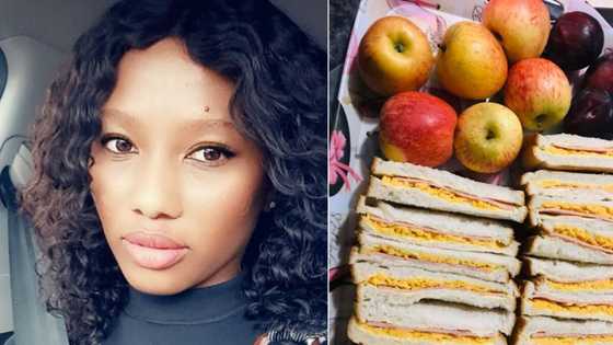 Generous young woman makes free lunch packs for general workers