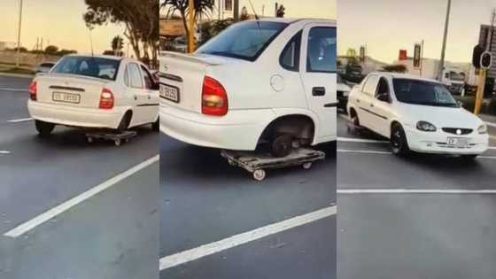 Driver uses trolley to replace wheel on Opel, ingenuity praised by Mzansi but concerns still raised