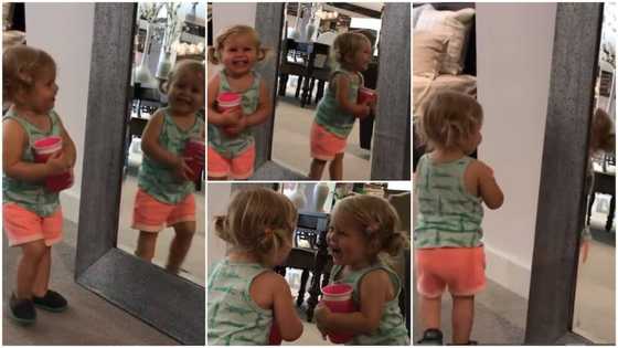 Baby's reaction to her own reflection in a mirror has peeps busting over the viral video