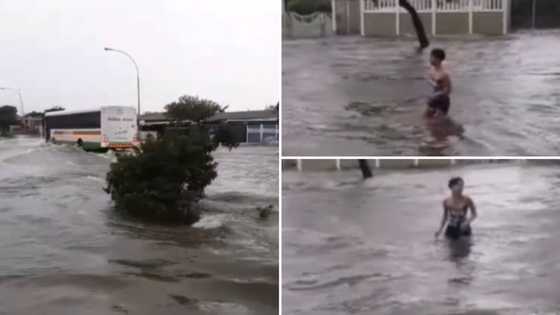 Cape Town floods have a lady making the most of the giant natural swimming pool in the middle of the street