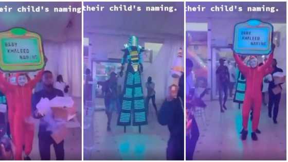 Nigerian parents turn their child's naming ceremony into club as they do 'Dorime' with fog & masquerade in video