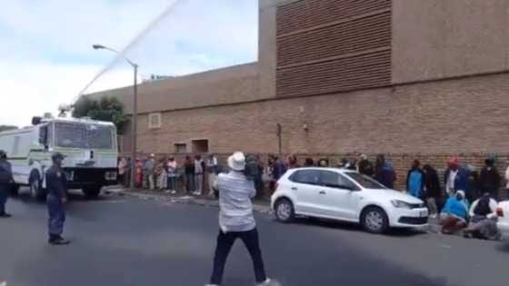 SA responds angrily to cops spraying sick and disabled in SASSA lines