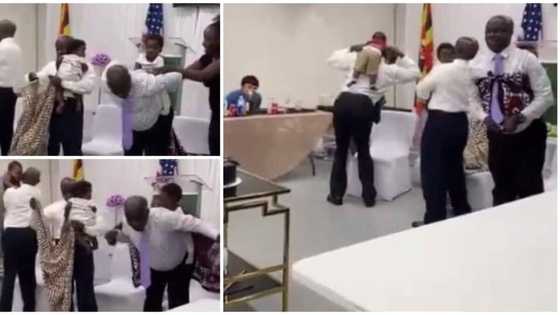 Men in corporate wear attempt to carry babies on their backs themselves in hilarious and adorable video