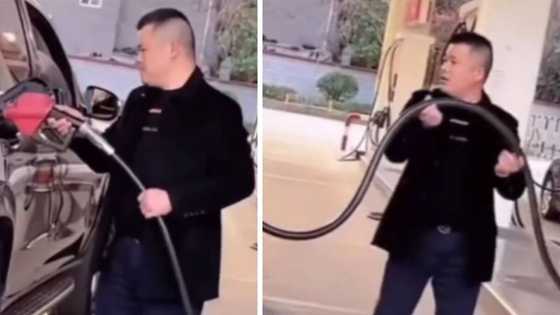 Times are tough as driver shakes fuel hose to get every last drop of petrol