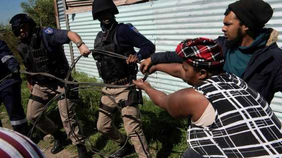 South African township resists police over illegal power cables