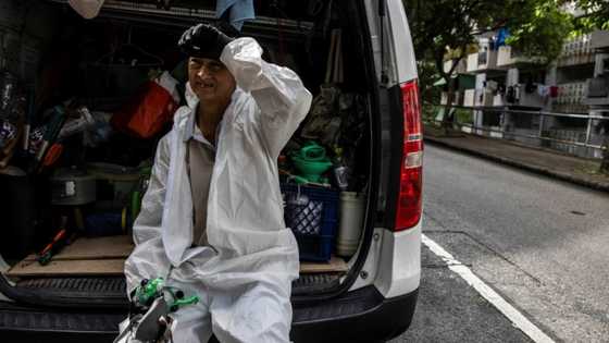 'In a sauna': Hong Kong's labourers swelter as temperatures rise
