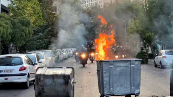 Six reported killed as Iran protests spread over woman's death