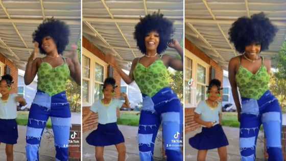 Gorgeous mom with poppin’ afro and sweet daughter leave the internet screaming over their fire dance clip