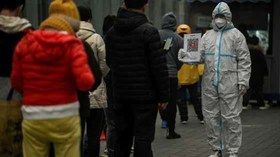 China reports more Covid deaths as infections surge