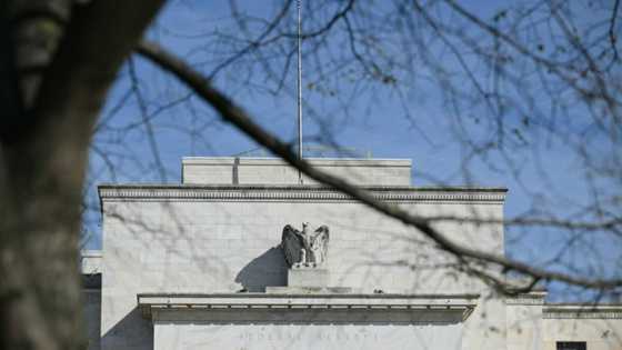 US Fed holds key rate, pencils in 3 cuts this year