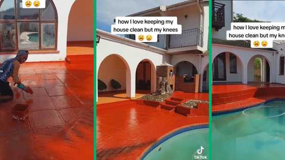 Hardworking woman polishes red porch outside her mansion using only a cloth