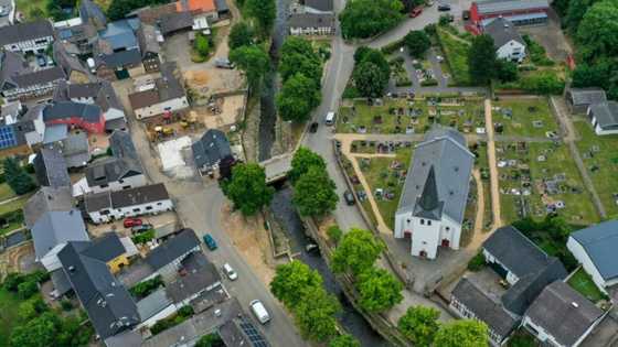 Flood anniversary prompts sadness and soul-searching in Germany
