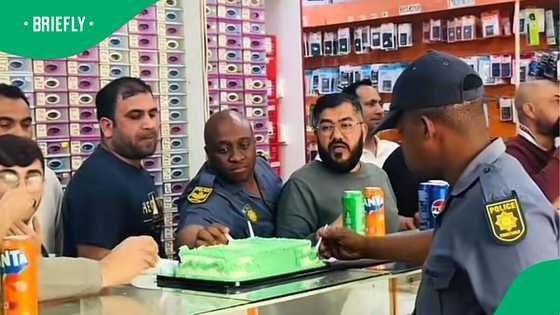 South African police men celebrate Pakistan's Independence Day with Pakistani community in Mzansi