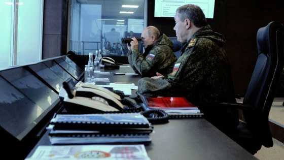 Bolstering Asia ties, Putin watches military drills with China