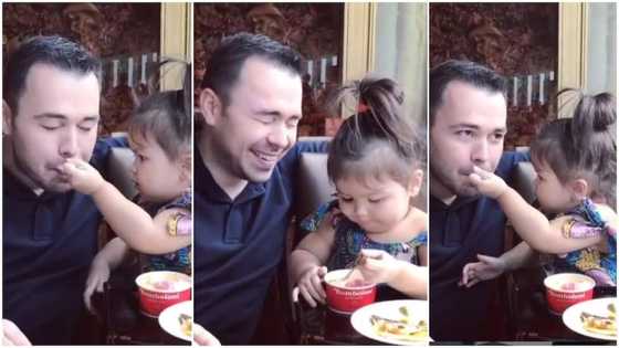 Baby spoon feeds father ice cream in adorable viral video