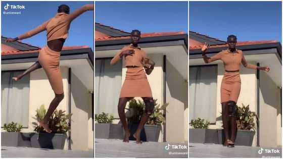 Young dark skinned lady "taller than house" dances in video, her height wows many online