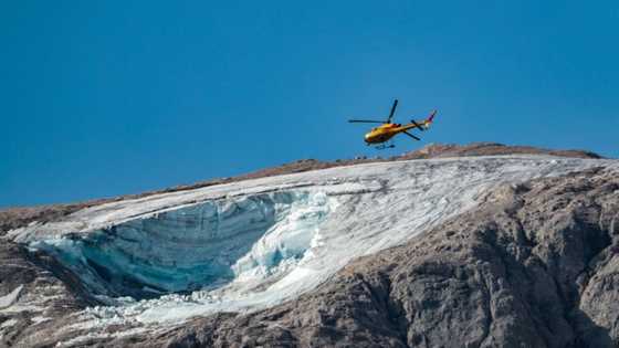Rescuers gather body parts after Italy glacier collapse