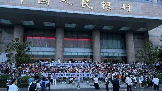 China banks to repay more customers after protests