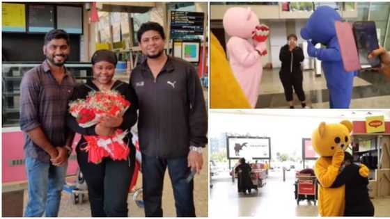 Indian family storm airport in video with flowers and 3 mascots to receive their son's African bae