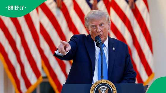 Trump spotted with darker hair colour after stepping off Air Force One in New Jersey