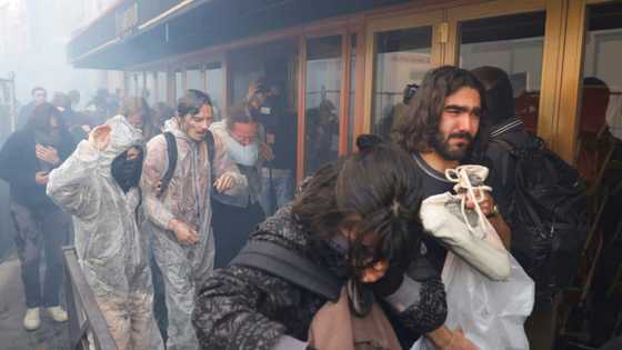 French police teargas protesters at oil giant's meeting