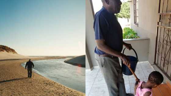 Pic of adorable toddler helping her blind grandpa walk goes viral