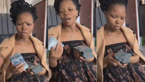 Video of man showering pretty woman with several wads of cash while telling her she must never go to her broke boyfriend again