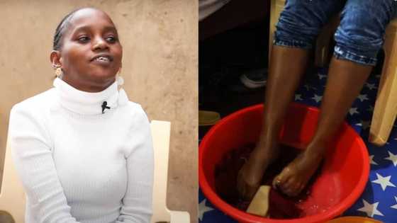 Handicapped woman who can't use her hands uses feet instead, 4 year old son helps her