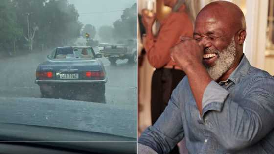 Video of couple driving in old fashioned Mercedes convertible in heavy rain has SA peeps laughing out loud