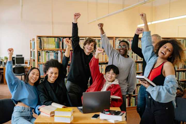 Happy students in the library